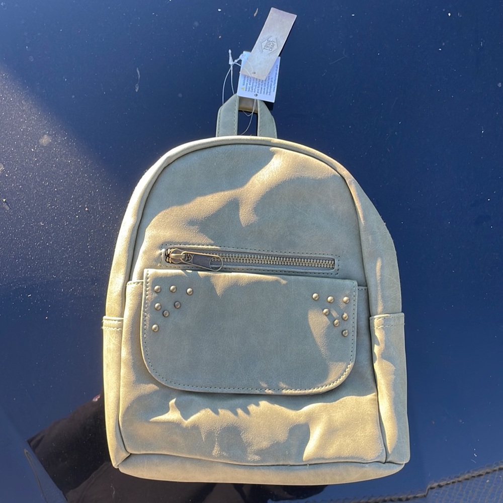 Brand new, with tags, True Craft small designer backpack in olive green color